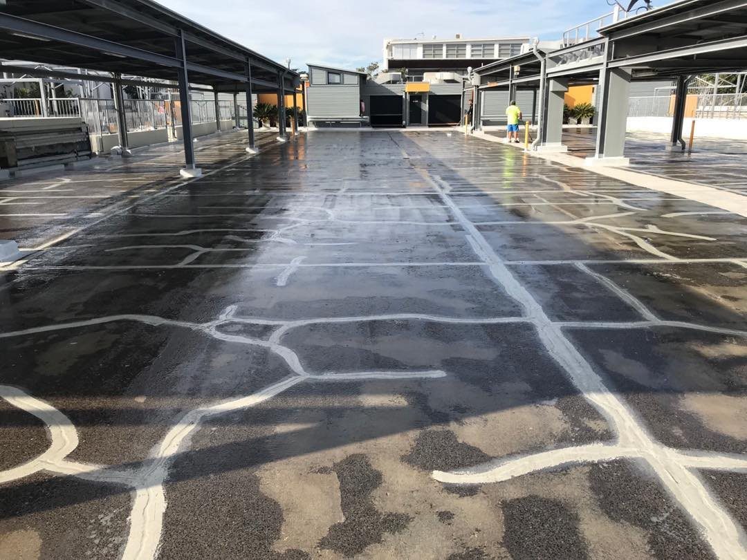 Cracks routed and filled across a rooftop carpark slab before waterproofing